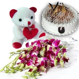 Bunch of 6 Stem Purple/Blue Orchids along with 500gm Black Forest Cake and 6 inches Cute Teddy Bear