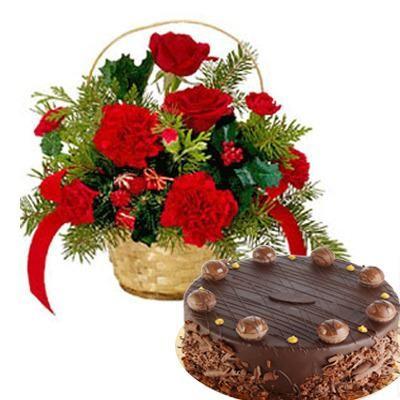 Basket Arrangement of 12 Red Carnations and Roses with 500 gms Chocolate Cake