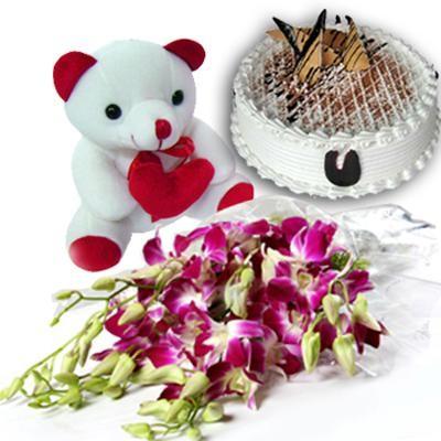 Bunch of 6 Stem Purple/Blue Orchids along with 500gm Black Forest Cake and 6 inches Cute Teddy Bear